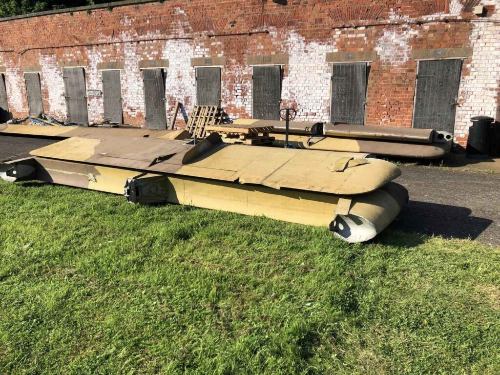 One of the dismantled wings from Blackburn Beverley lying on the grass.