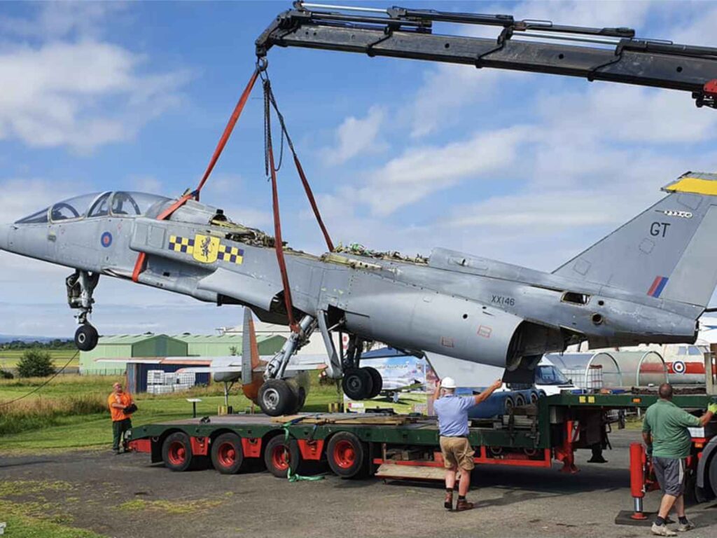 Using a crane to remove the fuselage of SEPECAT Jaguar XX146 off the trailer at the Solway Aviation Museum.