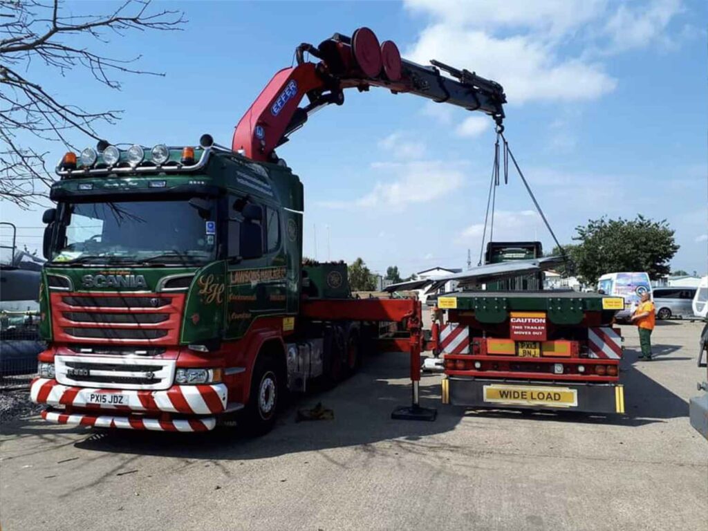 Using a crane to load the wings from the SEPECAT Jaguar XX146 onto a trailer.