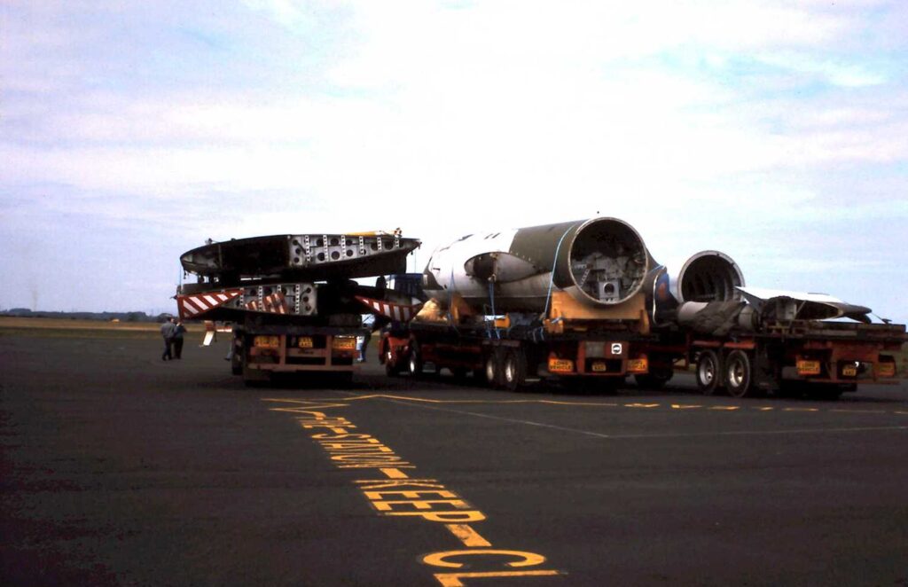 Parts of the Canberra, sitting on trailers on a disused runway at Carlisle Airport.