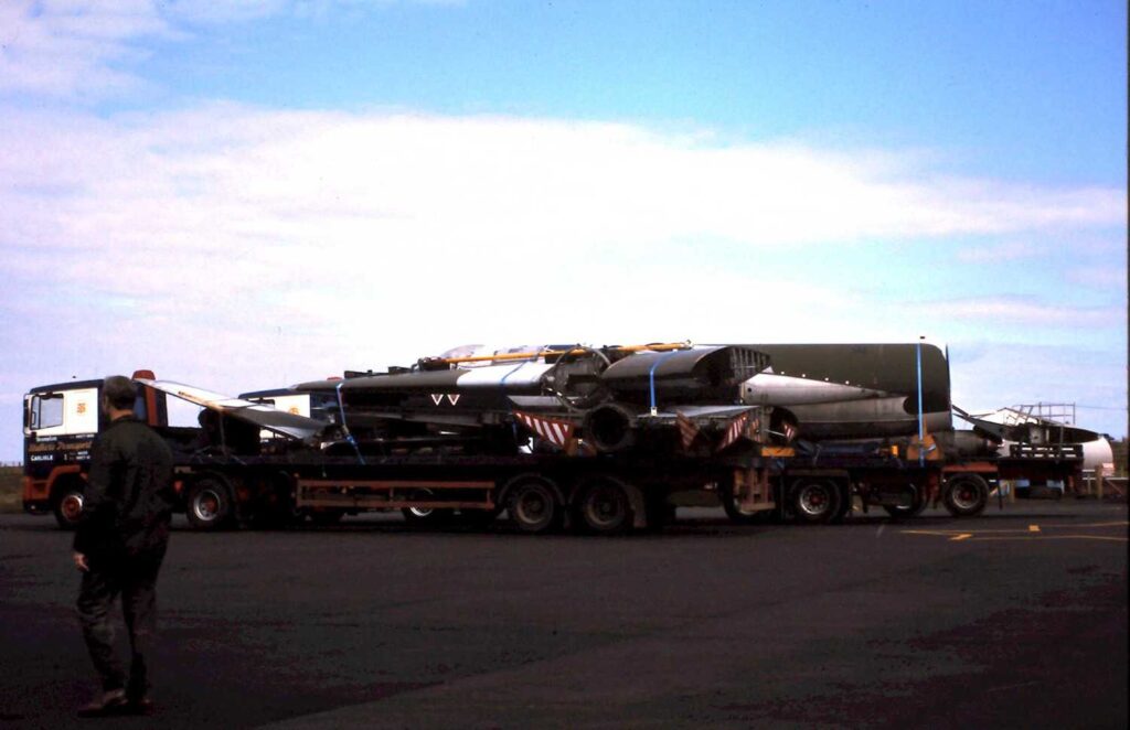 Parts of the Canberra, sitting on trailers on a disused runway at Carlisle Airport.