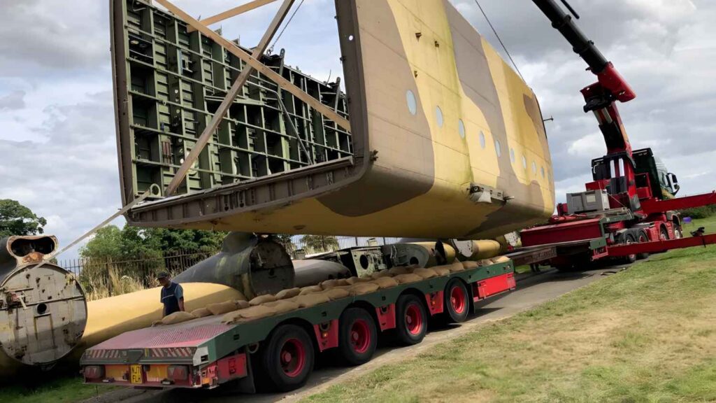 Blackburn Beverley fuselage being lifted onto a trailer by crane.