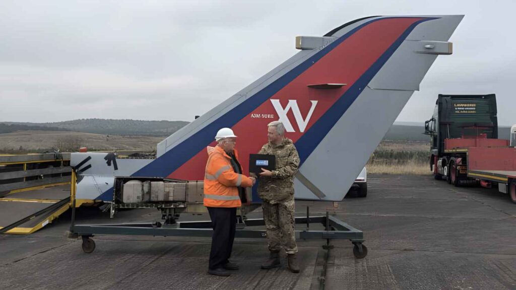 Dougie Kerr, receiving the aircraft history from Wing Commander Matt Lawrence.